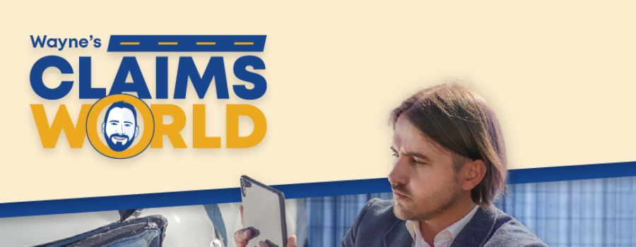 Wayne’s Claims World logo, A man in a suit using his phone to take a photo of a damaged car.