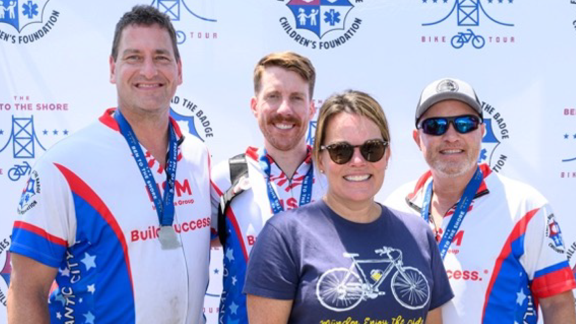 NSM Riders and Volunteers posing at Ben to the Shore