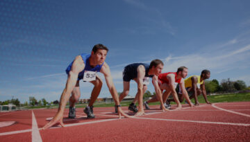 4 men getting ready to start race