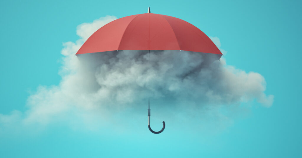 Red umbrella with clouds underneath